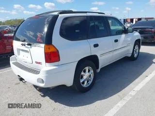 2006 GMC Envoy SLE with VIN 1GKDT13SX62258586, listed as a IAAI auction lot 42045967 with 143,225 mi miles. Bid and sale history available at carsss.com. Image 4.
