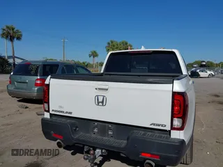 2021 Honda Ridgeline RTL-E with VIN 5FPYK3F7XMB011525, listed as a IAAI auction lot 41774012 with 98,031 mi miles and . Bid and sale history available at DreamBid. Image 16.