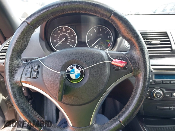 2011 BMW 1 Series 128i with VIN WBAUL7C5XBVE87044, listed as a IAAI auction lot 42095602 with 163,049 mi miles and . Bid and sale history available at carsss.com. Image 11.