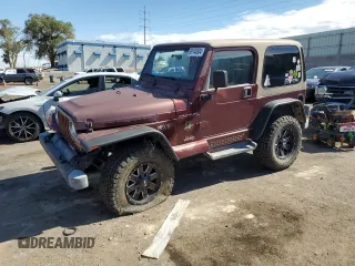 2002 Jeep Wrangler Sahara with VIN 1J4FA59S12P704608, listed as a Copart auction lot 69146504 with 125,920 mi miles and Salvage Title. Bid and sale history available at carsss.com. Image 1.
