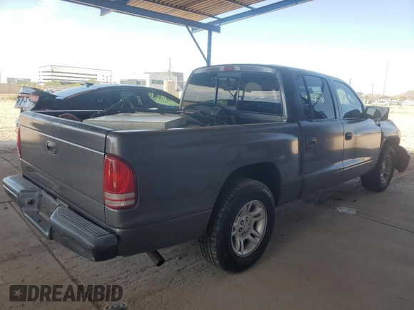 2001 Dodge Dakota Sport z VIN 1B7HL2AN21S298590, wystawiony jako Copart lot #54430385 z przebiegiem 175 365 mil mil oraz Szkoda całkowita • Salvage title. Historia ofert i sprzedaży dostępna na DreamBid. Obrazek 3.
