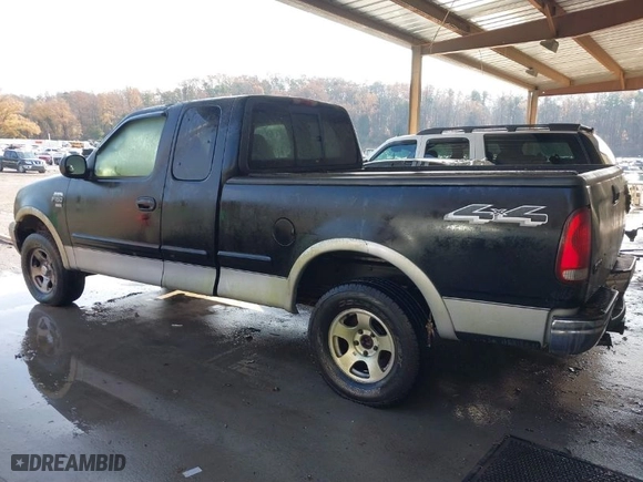 2000 Ford F-150 XL with VIN 1FTRX18LXYNA19385, listed as a IAAI auction lot 41075391 with 214,624 mi miles. Bid and sale history available at carsss.com. Image 3.