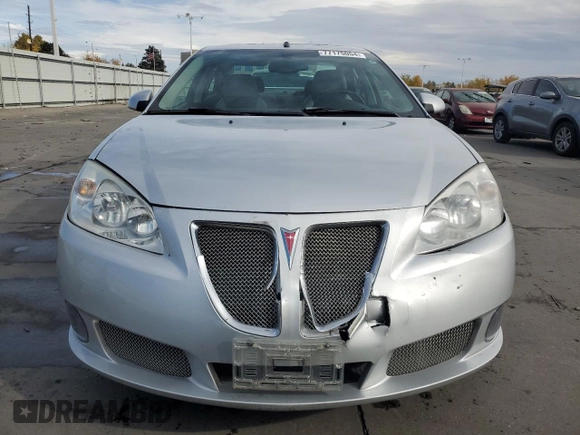 2009 Pontiac G6 with VIN 1G2ZL577094232011, listed as a Copart auction lot 77175054 with 133,353 mi miles and Salvage title. Bid and sale history available at DreamBid. Image 5.
