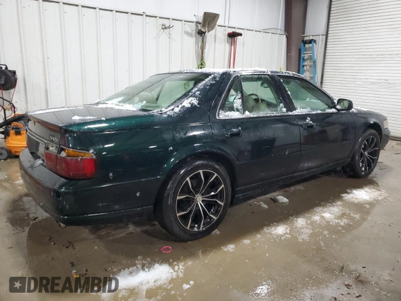 2000 Cadillac Seville Touring STS z VIN 1G6KY5494YU220613, wystawiony jako Copart lot #87338724 z przebiegiem 106 313 mil mil oraz Szkoda całkowita • Salvage title. Historia ofert i sprzedaży dostępna na DreamBid. Obrazek 3.