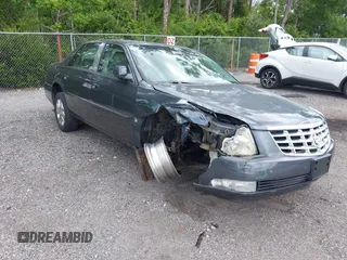 2009 Cadillac DTS 1SC z VIN 1G6KD57Y09U127751, wystawiony jako IAAI lot #42463390 z przebiegiem 125 065 mil mil oraz . Historia ofert i sprzedaży dostępna na DreamBid. Obrazek 1.