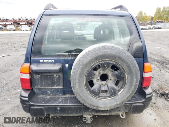 2004 Suzuki Vitara z VIN 2S3TD62VX46100019, wystawiony jako Copart lot #74291684 z przebiegiem 148 566 mil mil oraz Szkoda całkowita • Salvage title. Historia ofert i sprzedaży dostępna na DreamBid. Obrazek 6.