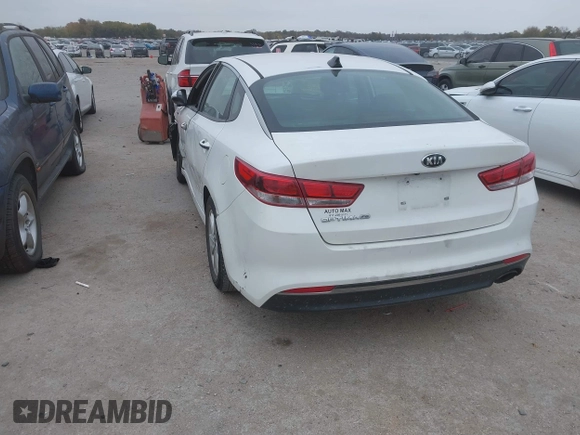 2016 Kia Optima LX with VIN KNAGT4L39G5104726, listed as a IAAI auction lot 40950914 with 128,728 mi miles. Bid and sale history available at carsss.com. Image 3.