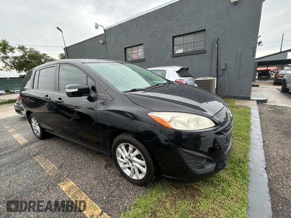 2015 Mazda 5 Sport z VIN JM1CW2BLXF0182880, wystawiony jako Copart lot #56959895 z przebiegiem 117 395 mil mil oraz Czysty tytuł • Clean title. Historia ofert i sprzedaży dostępna na DreamBid. Obrazek 1.
