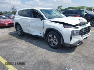 2023 Hyundai Santa Fe SE z VIN 5NMS14AJ6PH631267, wystawiony jako IAAI lot #42053761 z przebiegiem 17 880 mil mil oraz . Historia ofert i sprzedaży dostępna na DreamBid. Obrazek 1.
