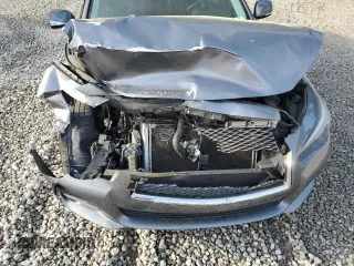 2015 Infiniti Q50 Premium with VIN JN1BV7AP3FM340598, listed as a Copart auction lot 50459855 with 104,938 mi miles and Salvage Title. Bid and sale history available at carsss.com. Image 11.