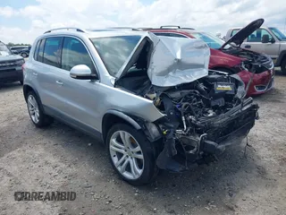 2013 Volkswagen Tiguan SEL with VIN WVGBV3AXXDW573624, listed as a IAAI auction lot 42188270 with 196,588 mi miles and . Bid and sale history available at DreamBid. Image 1.