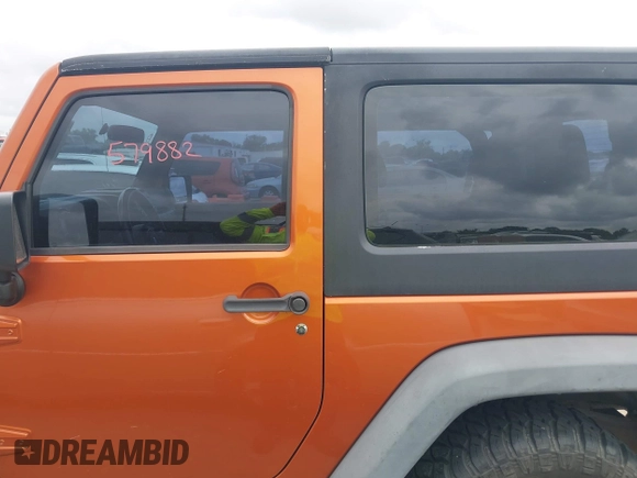 2011 Jeep Wrangler Sport with VIN 1J4AA2D1XBL579882, listed as a IAAI auction lot 42122353 with 153,885 mi miles and . Bid and sale history available at carsss.com. Image 14.