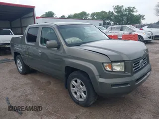2007 Honda Ridgeline RTL with VIN 2HJYK16517H513832, listed as a IAAI auction lot 42626411 with 209,171 mi miles and . Bid and sale history available at DreamBid. Image 1.