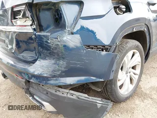 2021 Volkswagen Atlas SE z VIN 1V2WR2CA7MC568779, wystawiony jako IAAI lot #42132709 z przebiegiem 51 205 mil mil oraz . Historia ofert i sprzedaży dostępna na DreamBid. Obrazek 6.