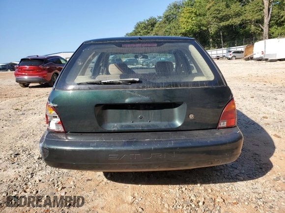 1997 Saturn SW z VIN 1G8ZK8278VZ379899, wystawiony jako Copart lot #74913664 z przebiegiem 126 186 mil mil oraz Szkoda całkowita • Salvage title. Historia ofert i sprzedaży dostępna na DreamBid. Obrazek 6.