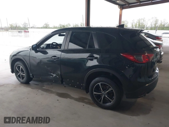 2016 Mazda CX-5 Touring with VIN JM3KE2CY2G0808424, listed as a IAAI auction lot 41880494 with 149,005 mi miles. Bid and sale history available at carsss.com. Image 14.