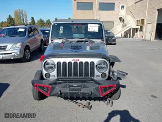 2015 Jeep Wrangler Unlimited Sport with VIN 1C4BJWDG7FL587014, listed as a IAAI auction lot 40641034 with 81,045 mi miles. Bid and sale history available at carsss.com. Image 13.