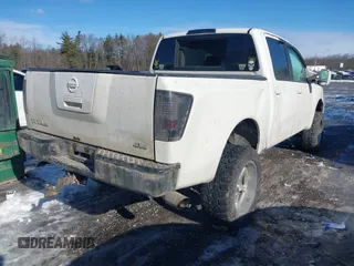 2012 Nissan Titan SV with VIN 1N6BA0EJ0CN309933, listed as a IAAI auction lot 41472091 with 147,635 mi miles. Bid and sale history available at carsss.com. Image 4.