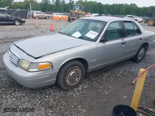 2000 Ford Crown Victoria with VIN 2FAFP73W6YX194471, listed as a IAAI auction lot 42102220 with 131,855 mi miles. Bid and sale history available at carsss.com. Image 2.