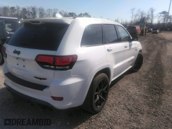2020 Jeep Grand Cherokee Trackhawk z VIN 1C4RJFN94LC117596, wystawiony jako IAAI lot #36356989 z przebiegiem 37 994 mil mil oraz . Historia ofert i sprzedaży dostępna na DreamBid. Obrazek 4.