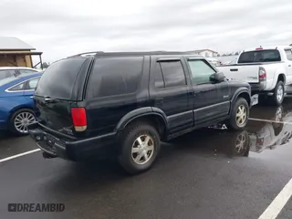 1999 Oldsmobile Bravada with VIN 1GHDT13W0X2712225, listed as a IAAI auction lot 41550117 with 170,706 mi miles. Bid and sale history available at carsss.com. Image 4.