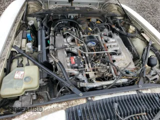 1989 Jaguar XJS z VIN SAJNA5840KC150684, wystawiony jako Copart lot #48081805 z przebiegiem 93 444 mil mil oraz Czysty tytuł • Clean title. Historia ofert i sprzedaży dostępna na DreamBid. Obrazek 11.