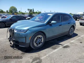 2022 BMW iX xDrive50 with VIN WB523CF07NCK56145, listed as a Copart auction lot 60202103 with 10,822 mi miles. Bid and sale history available at carsss.com. Image 1.