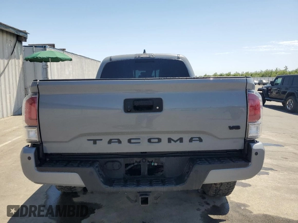 2020 Toyota Tacoma SR5 z VIN 3TMDZ5BN0LM094976, wystawiony jako Copart lot #58695515 z przebiegiem 84 025 mil mil oraz Czysty tytuł • Clean title. Historia ofert i sprzedaży dostępna na DreamBid. Obrazek 6.