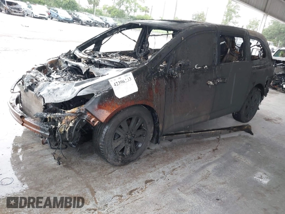 2014 Honda Odyssey Touring with VIN 5FNRL5H9XEB015029, listed as a IAAI auction lot 42396233 with Not provided miles and . Bid and sale history available at DreamBid. Image 2.