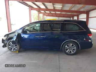 2017 Honda Odyssey Touring with VIN 5FNRL5H90HB017215, listed as a IAAI auction lot 42574528 with 61,386 mi miles and . Bid and sale history available at DreamBid. Image 14.