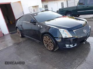 2011 Cadillac CTS Performance with VIN 1G6DJ1ED7B0135191, listed as a IAAI auction lot 41660128 with 121,567 mi miles and . Bid and sale history available at DreamBid. Image 1.
