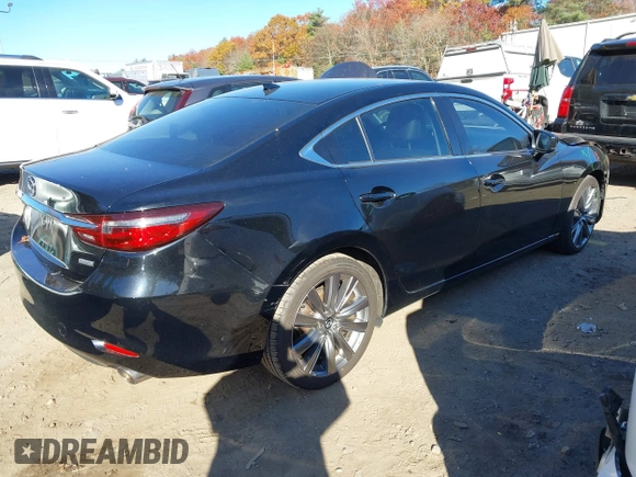 2018 Mazda 6 Grand Touring with VIN JM1GL1TY0J1319083, listed as a IAAI auction lot 40852818 with 57,408 mi miles and . Bid and sale history available at DreamBid. Image 4.