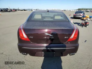 2014 Jaguar XJ with VIN SAJWA1CZ3E8V69877, listed as a Copart auction lot 48159005 with 57,567 mi miles and Clean Title. Bid and sale history available at DreamBid. Image 6.