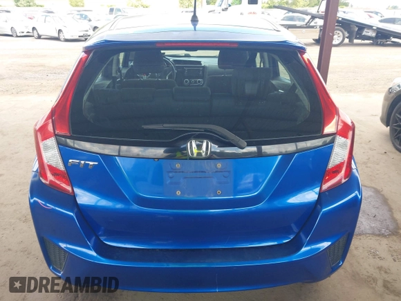 2015 Honda Fit LX z VIN 3HGGK5H51FM711607, wystawiony jako IAAI lot #42249495 z przebiegiem Nie podano mil oraz . Historia ofert i sprzedaży dostępna na DreamBid. Obrazek 17.
