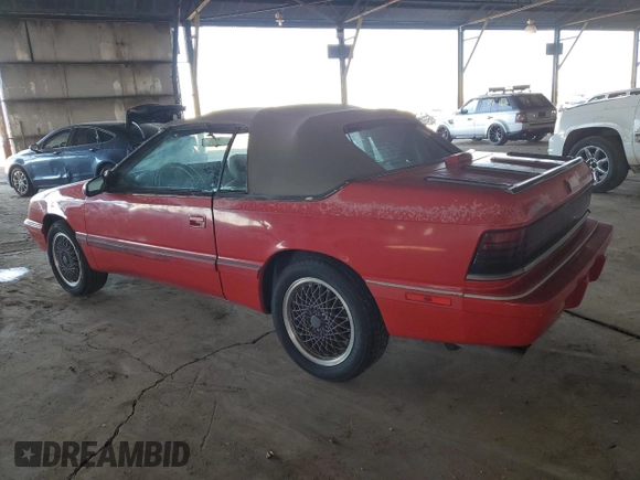 1990 Chrysler LeBaron z VIN 1C3XJ45J9LG405682, wystawiony jako Copart lot #48690985 z przebiegiem 75 714 mil mil oraz Tytuł czysty. Historia ofert i sprzedaży dostępna na DreamBid. Obrazek 2.