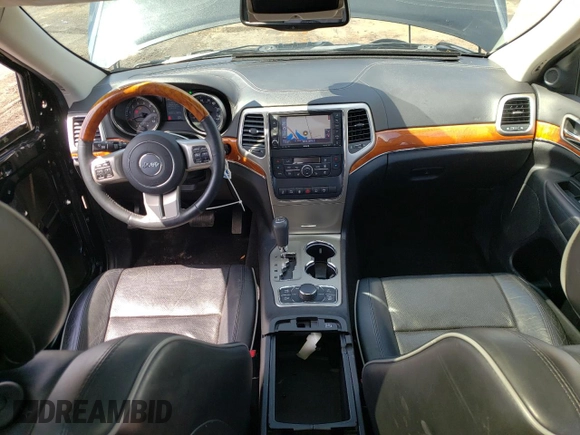 2013 Jeep Grand Cherokee Overland with VIN 1C4RJFCT2DC576125, listed as a Copart auction lot 52595165 with 100,361 mi miles and Salvage Title. Bid and sale history available at carsss.com. Image 8.