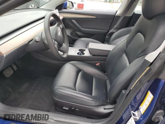 2023 Tesla Model 3 with VIN 5YJ3E1EA7PF450973, listed as a Copart auction lot 61082175 with 47,029 mi miles and Salvage title. Bid and sale history available at DreamBid. Image 7.