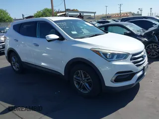 2017 Hyundai Santa Fe 2.4L z VIN 5XYZTDLB0HG403842, wystawiony jako IAAI lot #42206543 z przebiegiem 77 900 mil mil oraz . Historia ofert i sprzedaży dostępna na DreamBid. Obrazek 1.