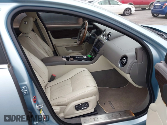 2013 Jaguar XJ with VIN SAJWA2G13DLV57881, listed as a IAAI auction lot 41478667 with 73,764 mi miles. Bid and sale history available at carsss.com. Image 5.