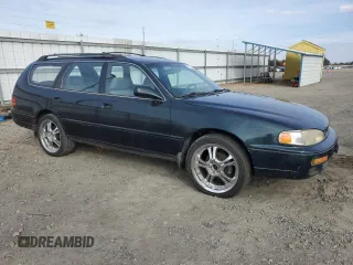 1995 Toyota Camry LE z VIN 4T1GK12W4SU079938, wystawiony jako Copart lot #77065084 z przebiegiem 222 731 mil mil oraz Szkoda całkowita • Salvage title. Historia ofert i sprzedaży dostępna na DreamBid. Obrazek 4.