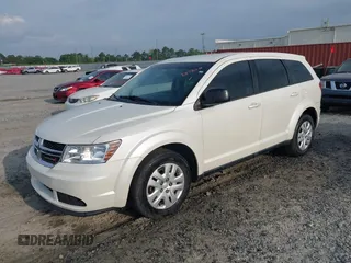 2015 Dodge Journey SE z VIN 3C4PDCAB9FT592689, wystawiony jako IAAI lot #42108322 z przebiegiem 158 140 mil mil oraz . Historia ofert i sprzedaży dostępna na DreamBid. Obrazek 2.