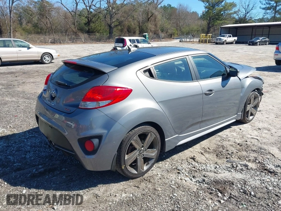 2015 Hyundai Veloster Turbo with VIN KMHTC6AE8FU229198, listed as a IAAI auction lot 41596345 with 74,943 mi miles. Bid and sale history available at carsss.com. Image 4.