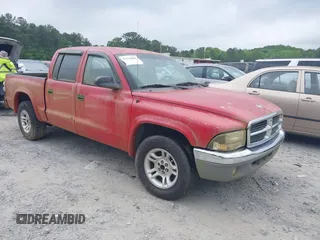 2004 Dodge Dakota SLT with VIN 1D7HL48N84S717599, listed as a IAAI auction lot 42132810 with 305,900 mi miles and . Bid and sale history available at carsss.com. Image 1.