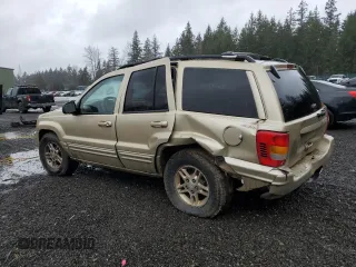 1999 Jeep Grand Cherokee Limited with VIN 1J4GW68N2XC581746, listed as a Copart auction lot 45413775 with 284,226 mi miles and Salvage Title. Bid and sale history available at carsss.com. Image 2.