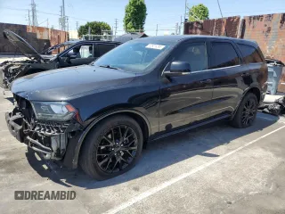 2015 Dodge Durango R/T with VIN 1C4SDJCT2FC892266, listed as a Copart auction lot 53921295 with 180,033 mi miles and Salvage title. Bid and sale history available at DreamBid. Image 1.