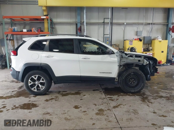 2016 Jeep Cherokee Trailhawk z VIN 1C4PJMBS6GW242123, wystawiony jako IAAI lot #41156712 z przebiegiem 136 596 mil mil oraz . Historia ofert i sprzedaży dostępna na DreamBid. Obrazek 14.