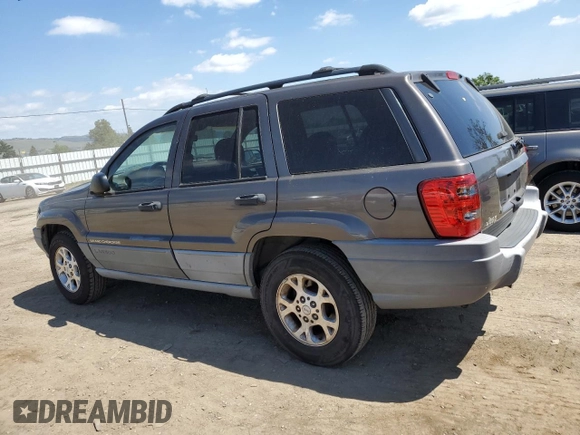 2000 Jeep Grand Cherokee Laredo with VIN 1J4G248S6YC333068, listed as a Copart auction lot 54972765 with 183,775 mi miles and Clean title. Bid and sale history available at DreamBid. Image 2.