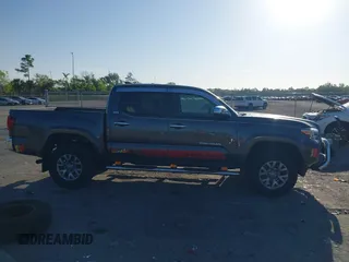 2018 Toyota Tacoma SR5 with VIN 3TMAZ5CN4JM069965, listed as a IAAI auction lot 41798238 with 124,619 mi miles and . Bid and sale history available at DreamBid. Image 14.