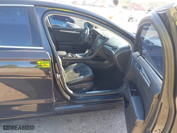 2015 Ford Fusion Titanium Hybrid with VIN 3FA6P0RUXFR119698, listed as a IAAI auction lot 41791411 with 140,646 mi miles. Bid and sale history available at carsss.com. Image 5.