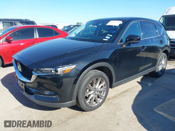 2021 Mazda CX-5 Grand Touring with VIN JM3KFADM1M0406098, listed as a IAAI auction lot 41654735 with 33,050 mi miles. Bid and sale history available at carsss.com. Image 17.